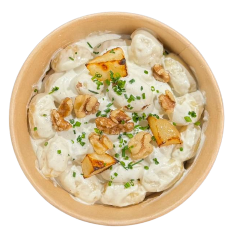 Gnocchis amb salsa de formatge, nous i pera rostida